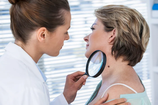 A dermatologist is examining their patient’ skin with an aim of proper diagnosis and treatment